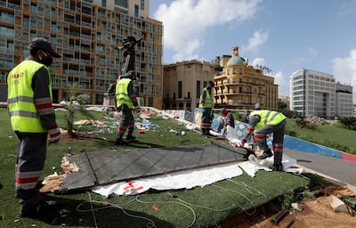 Workers clean the area around Martyrs' Square after Lebanese security forces cleared away a protest camp. Reuters