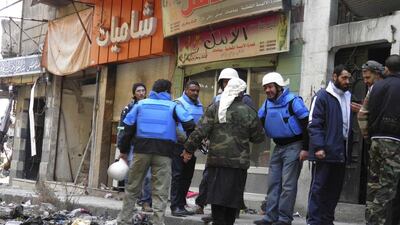 United Nations members arrive to the besieged neighbourhoods of Homs to supply humanitarian aid on February 8, 2014. Thaer Al Khalidiya/Reuters