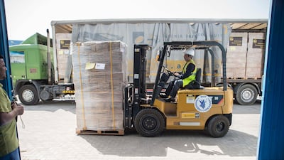The World Food Programme loads trucks with food and supplies in response to the drought in Somalia at the International Humanitarian City Warehouses in Dubai. Antonie Robertson / The National
