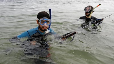 Palestinian spear-fisherman Ashraf Al-Amoudi prepares to dive underwater at the Mediterranean Sea off the coast of the southern Gaza Strip. Reuters