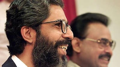 Imran Farooq, left, laughs with Muttahida Qaumi Movement founder Altaf Hussain in 1999. Yesterday Mr Farooq was found dead with head injuries and stab wounds in London.