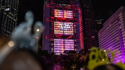 Countdown clocks are projected on to the buildings of Hong Kong. AP
