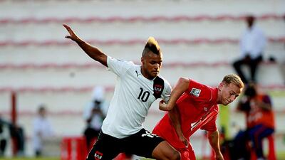 Valentin Lazaro of Austria, left, and Jordan Haynes of Canada strive for possession at the Rashid Stadium in Dubai. Satish Kumar / The National