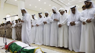 Sheikh Mohammed bin Saud Al Qasimi, Crown Prince of Ras Al Khaimah, takes part in funeral prayers for serviceman Hassan Abdullah Al Bishir in Sheikh Zayed Mosque in Ras Al Khaimah on Wednesday. Duncan Chard for the National