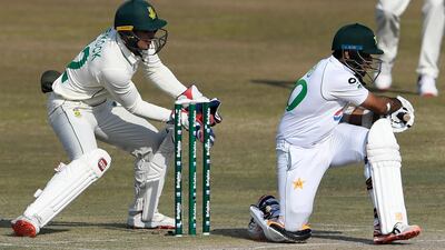 South Africa captain and wicketkeeper Quinton de Kock catches out Pakistan's Abid Ali for 13, off the bowling of Keshav Maharaj. AFP