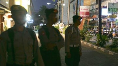 File photo: Police stand at the site of the blast in Bali in 2005.