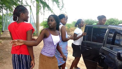 Students of the Moi University leave after escaping an attack by Somalia's Shabab gunmen in Garissa on April 2, 2015. The Al Qaeda-linked militants stormed a university dormitory and killed at least 70 people. AFP Photo