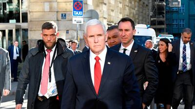 US Vice President Mike Pence crosses a street to give a statement in front of the Bayerischer Hof hotel at the 55th Munich Security Conference in Munich. AFP