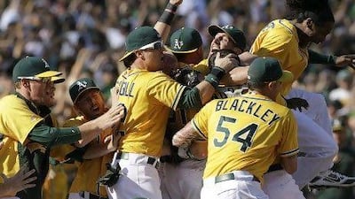 Oakland Athletics celebrate the AL West title after their 12-5 win over Texas Rangers.