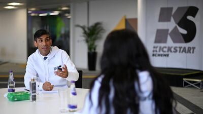 Mr. Sunak engages his audience at a Kickstart employment scheme event while wearing a branded hoodie. Getty Images