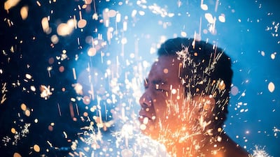 A performs the "eating flowers" ritual in front of a temple in Baitang, Fujian province China. Johannes Eisele / AFP Photo
