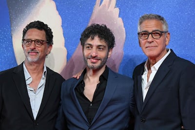 Kodeih with Grant Heslov, left, and George Clooney at the screening of Furies in Venice. AFP