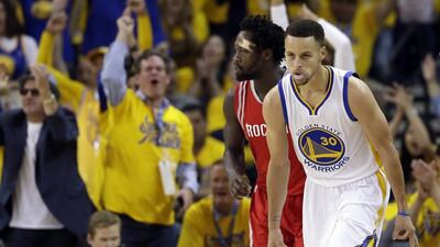 Golden State Warriors' Stephen Curry (30) celebrates after making a 3-point basket against the Houston Rockets during the first half in Game 1 of a first-round NBA basketball playoff series Saturday, April 16, 2016, in Oakland, Calif. Marcio Jose Sanchez / AP Photo