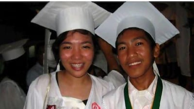 Jaymar Santillan, right, graduated from high school in April this year and is now a first-year accounting student at university.