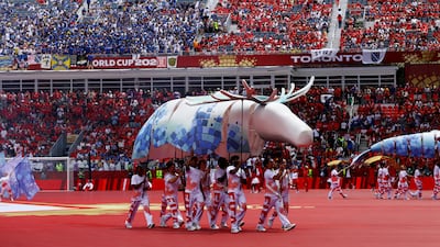 Peformers with a moose puppet. Reuters