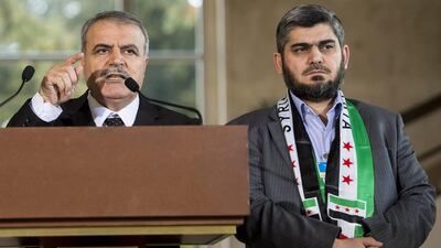 Asaad Al Zoubi (L), head of the opposition High Negotiations Committee (HNC), speaks at a press conference alongside the HNC's chief negotiator, Mohammed Alloush, at the European headquarters of the United Nations in Geneva on March 22, 2016. Jean-Christophe Bott/EPA