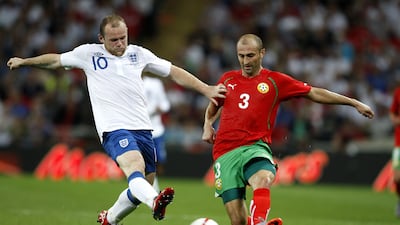 England's Wayne Rooney, left, and Bulgaria's Iliyan Stoyanov battle for the ball.