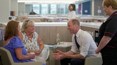Prince William talks to patients during a visit to open the Oak Cancer Centre research and treatment facility at the Royal Marsden Hospital in Surrey. PA