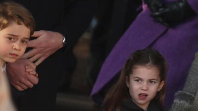 Britain's Prince George and Princess Charlotte, children of the Duke and Duchess of Cambridge after attending a Christmas day service at the St Mary Magdalene Church. AP