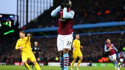 Christian Benteke puts his head in his hands after missing a chance against Liverpool. Aston Villa have failed to score in their last five outings. Clive Mason/Getty Images