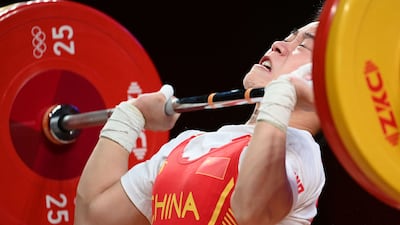 China's Hou Zhihui triumphs in the women's 49kg weightlifting.