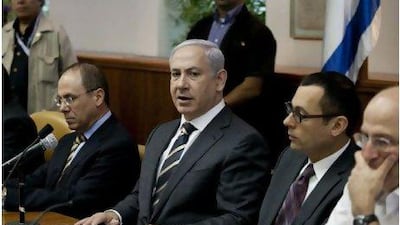 Israeli prime minister Benjamin Netanyahu, centre, pictured at the weekly cabinet meeting in his Jerusalem office yesterday, said he had 'reservations' about the French peace plan.