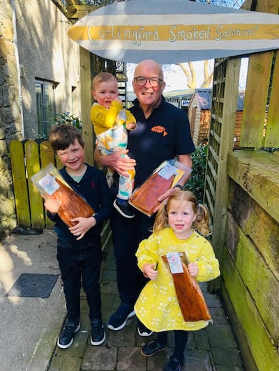 Carlingford Smoked Salmon owner Harry Jordan prepares for President Biden's visit with grandchildren Sam, seven, Bea, four, and 18-month-old Joey. Photo: Harry Jordan