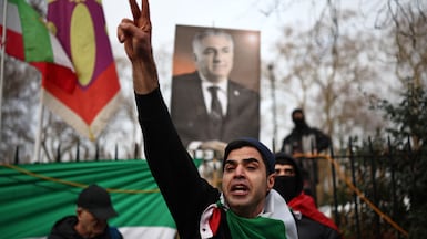 An anti-regime protester at the Iranian embassy in London. Many Iranians abroad have been unable to reach relatives inside the country and fear for their welfare. AFP