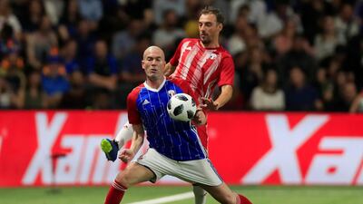 Zinedine Zidane of the France 98 team controls the ball while under pressure. Gonzalo Fuentes / Reuters