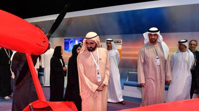 Sheikh Mohammed bin Rashid and Dr Sultan Al Jaber check out the Flyanno, a "flying jetski" that reaches top speeds of 120kph and can climb to an altitude of 150m. Wam