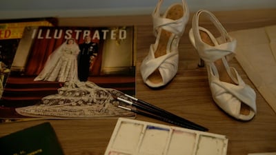 Prototype shoes for the ones Britain's Queen Elizabeth II wore at her wedding are displayed in the Royal Style in the Making exhibition at Kensington Palace in London. AP Photo