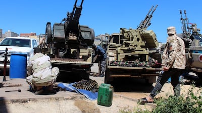 Militants, reportedly from the Misrata militia, stand on gun-mounted vehicles as they prepare to move to the frontline to join forces loyal to the UN-backed unity government, in Tripoli, Libya. EPA