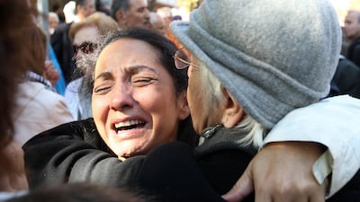The relative of an army officer cries outside the appeals court in Ankara after the court upheld the convictions of scores of top retired military officers over a 2003 coup plot Adem Altan / AFP