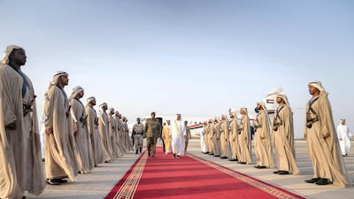 Sheikh Mohamed bin Zayed, Crown Prince of Abu Dhabi and Deputy Supreme Commander of the UAE Armed Forces (centre right) receives Lieutenant General Abdel Fattah Al Burhan Abdelrahman, Head of Transitional Military Council of Sudan (centre left), at the Presidential Airport. Mohamed Al Hammadi / Ministry of Presidential Affairs