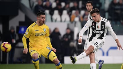 Juventus'Paulo Dybala shoots to open the scoring. AFP