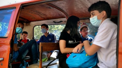 Pupils in a school bus at the end of their school day in Beirut. AP Photo