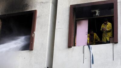 Firefighters put out a blaze near the residence of Yemeni ex-president Ali Abdullah Saleh. Yayha Arhab / EPA