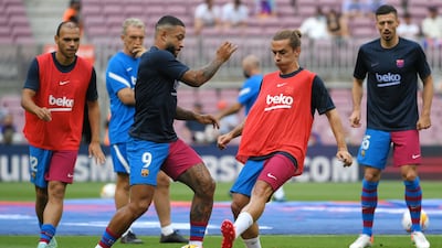 Antoine Griezmann and Memphis Depay warm up before the start of the match between Barcelona and Getafe. AFP