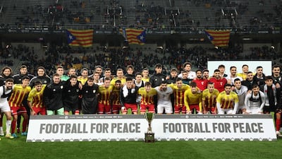 Players at the end of the friendly between Catalonia and Palestine. AFP