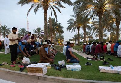 Muslims pray just after breaking their fast at Sheikh Zayed Grand Mosque. Leslie Pableo for The National