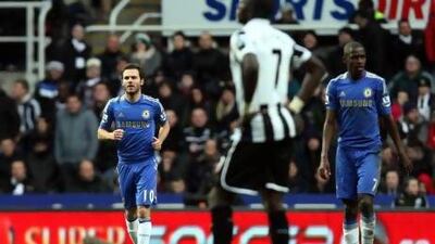 Juan Mata, left, celebrates Chelsea's goal against Newcastle United on Saturday. Scott Heppell / AP Photo