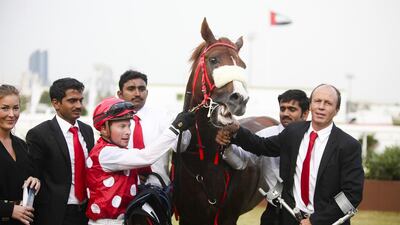 Trainer Ernst Oertel, right, was given a four-month ban after he was found guilty for administering ibuprofen. Lee Hoagland / The National
