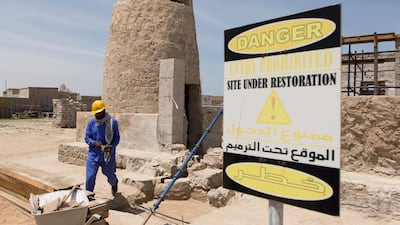 A worker at the Jazirat Al Hamra heritage village and archaeological site in Ras al Khamiah, the best preserved traditional coastal town in the GCC. Christopher Pike / The National