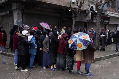 Residents of Ashrafieh queue to receive aid after days of clashes. Reuters