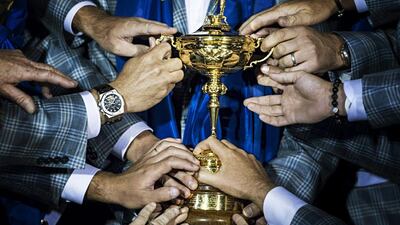 Members of Team Europe hold the Ryder Cup. Brendan Smialowski / AFP Photo