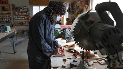 A Palestinian woman works at a carpenter workshop, established and run by a group of women, in the village of Al Walajeh near the West bank town of Bethlehem. AFP