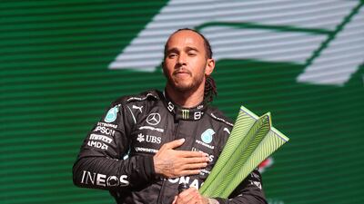 Lewis Hamilton on the podium after winning the 2021 Brazilian Grand Prix for Mercedes. AFP
