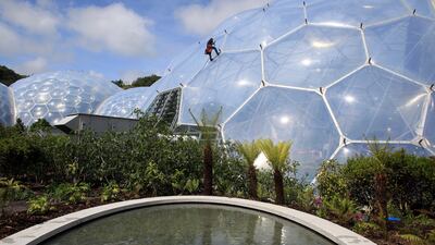 A technician climbs a biome at the Eden Project in Cornwall, one of the sites of the Lighting up the Nation event. Getty