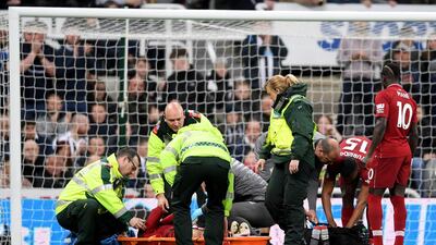 Salah receives medical treatment. Laurence Griffiths / Getty Images