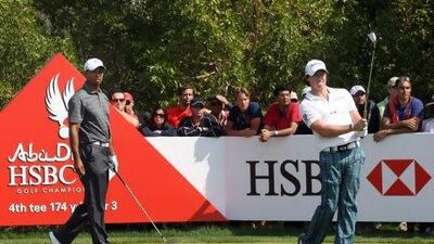Rory McIlroy, right, met Tiger Woods on the links for their first official tournament together last year at the Abu Dhabi HSBC Championship. The pair will play again in this year's tournament, which starts Thursday.